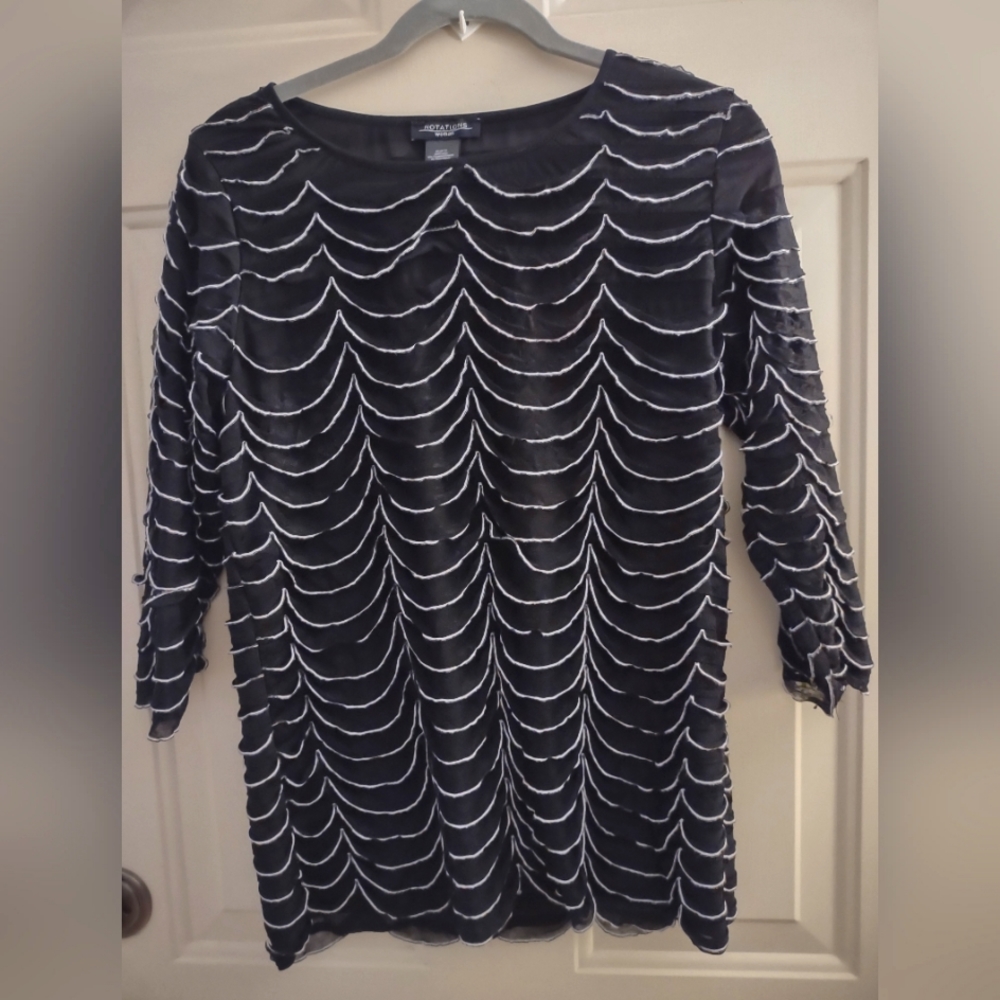 Woman's Notations lacy and layered black and white shirt.